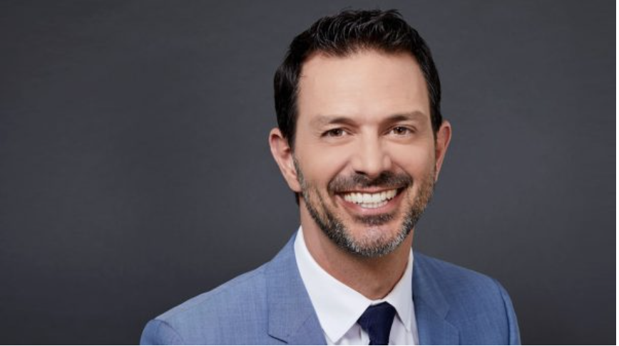 Head-shot of Mr. Istook who is wearing a blue blazer up against a gray background. 